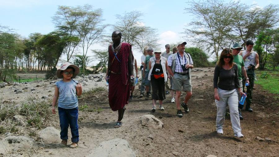 HWF team walking with local Maasai community members in the Mara