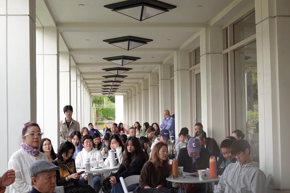 Families and youth gathered under the Nixon Library garden pavilion for the Future Keepers workshop